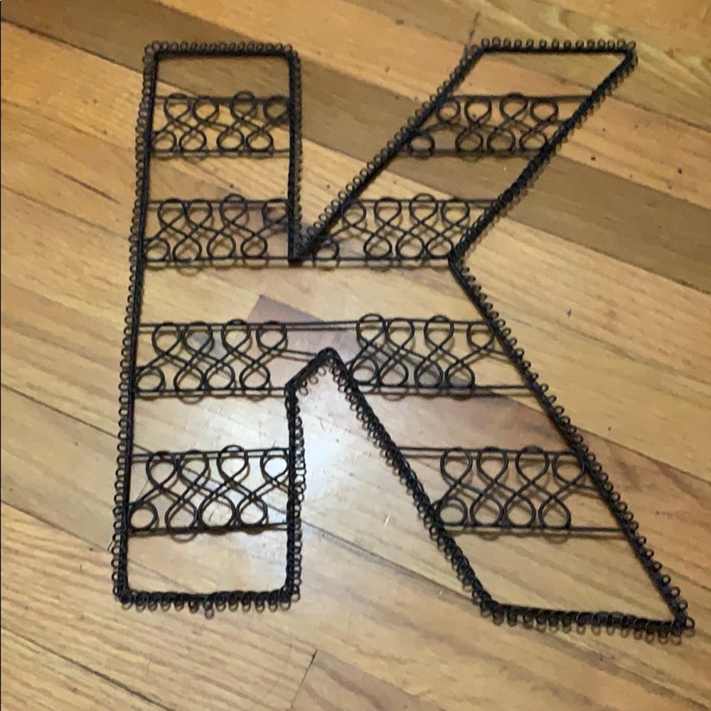 “K” black sign
